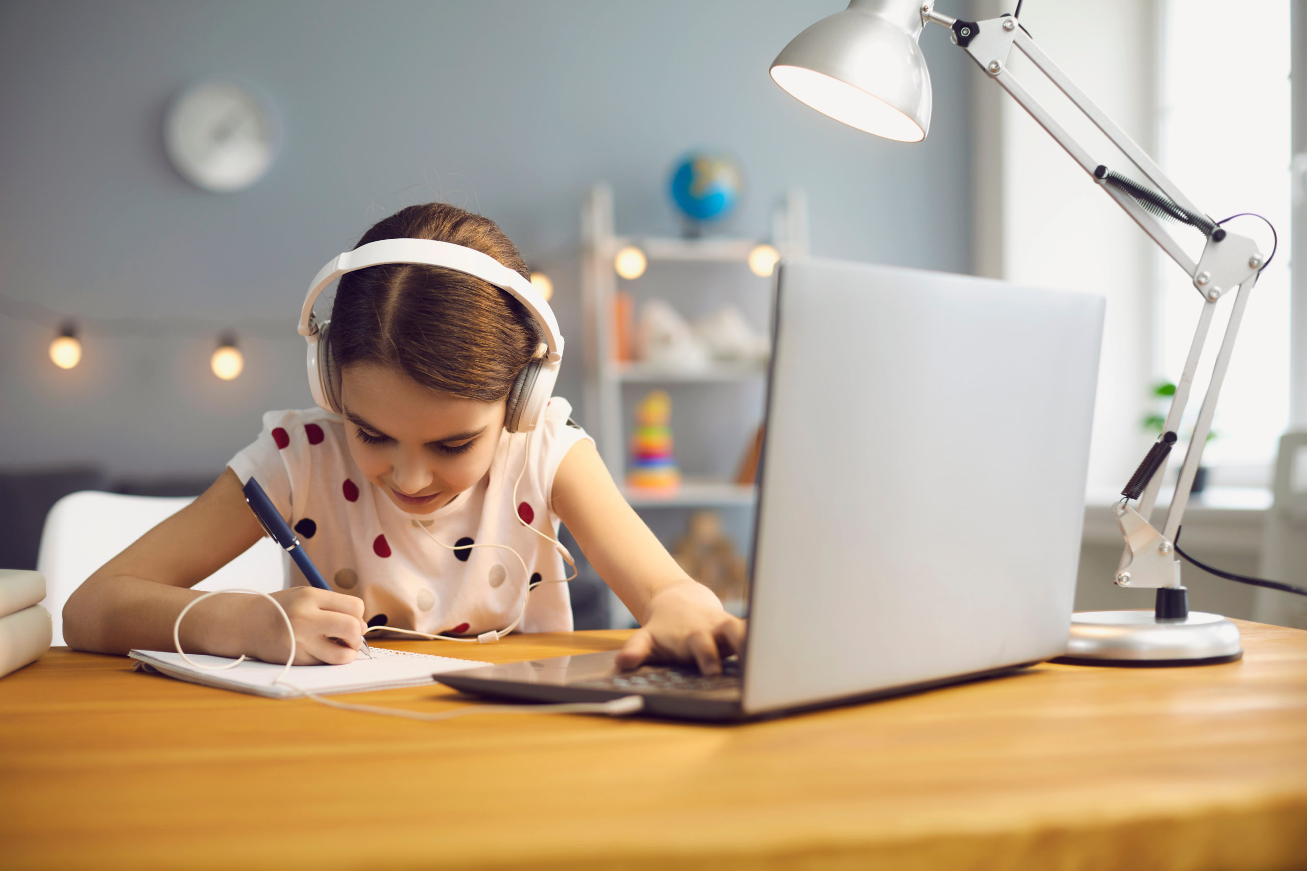 Online,Education,For,Children.,A,Girl,In,Headphones,Makes,An